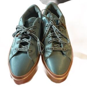 Satin blue adidas sneakers with rose gold soles. These are barely worn!